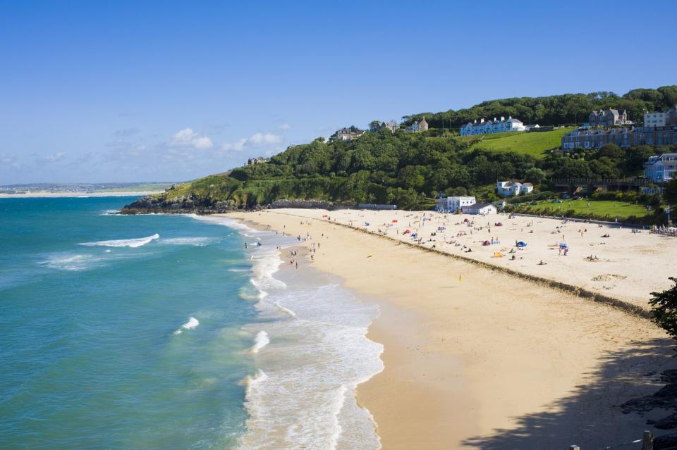 <p>Framed by a glittering bay, Porthminster Beach has glorious views across to Godrevy Lighthouse, inspiration for Virginia Woolf’s To the Lighthouse.</p><p><a class="link " href="https://www.booking.com/" rel="nofollow noopener" target="_blank" data-ylk="slk:FIND ACCOMMODATION;elm:context_link;itc:0;sec:content-canvas">FIND ACCOMMODATION </a><br></p>