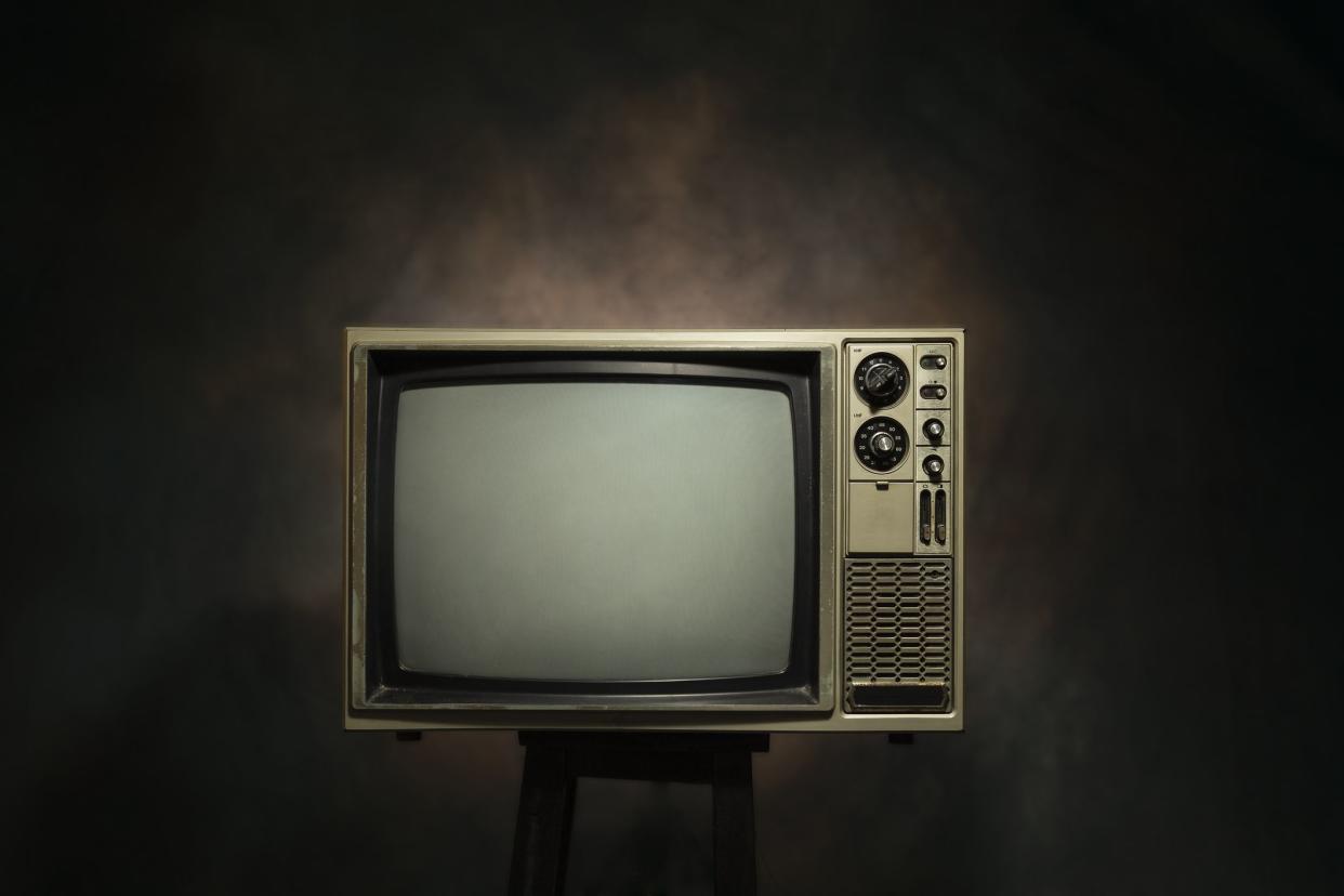 Retro old television on the black background, clipping path