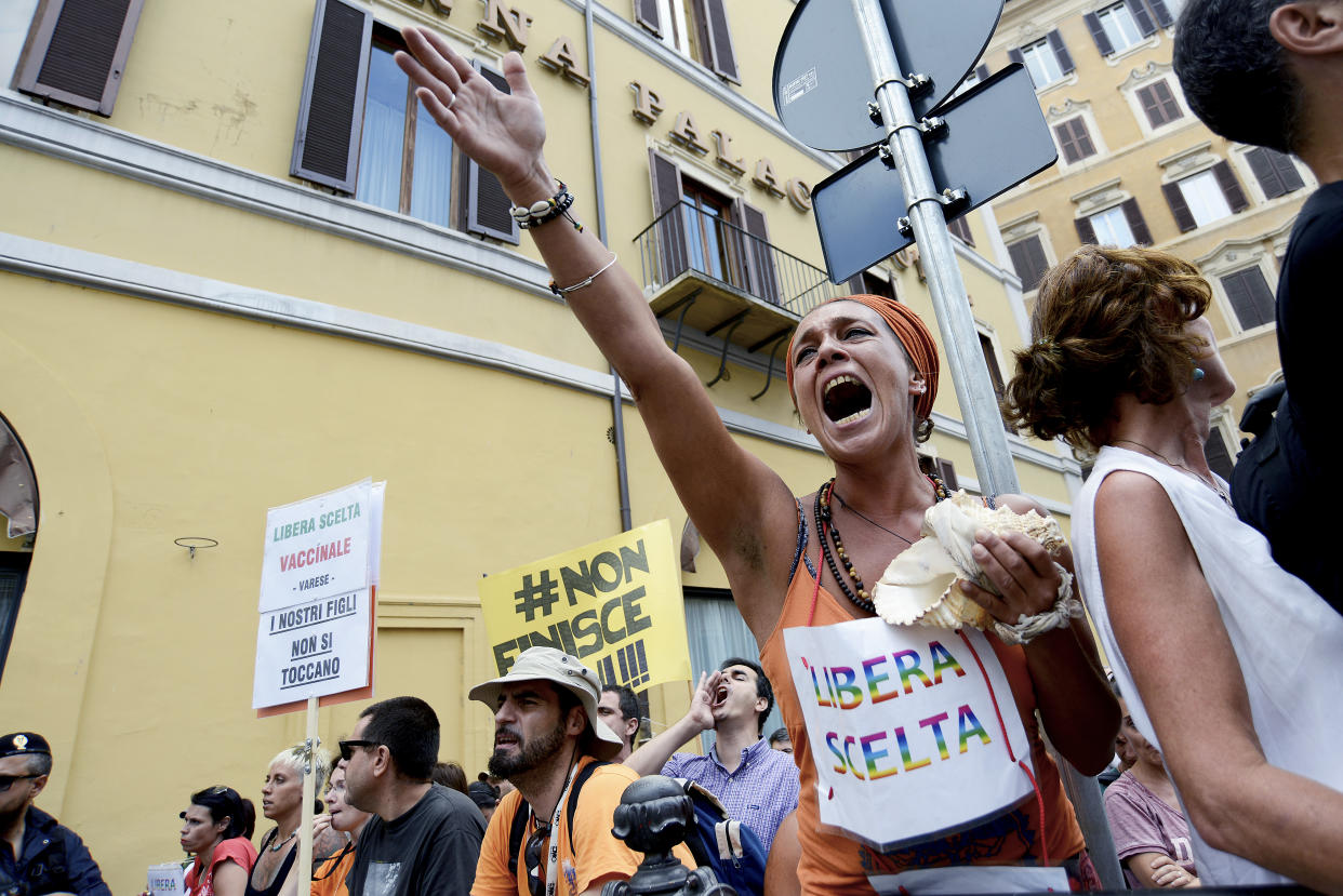 People in Italy protested the enacting of a law that makes 16 different vaccinations mandatory for school-aged children. Italy, Australia, and many other countries are enacting more aggressive action against parents who refuse to vaccinate their children. (Photo: Getty Images)