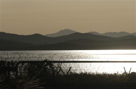 The Imjin River separates North Korea (top) and the South in this picture taken from the South in Paju, north of Seoul September 16, 2013. REUTERS/Lee Jae-Won