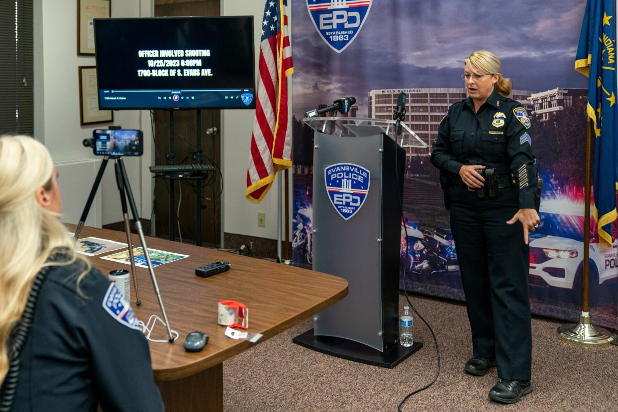 Evansville Police Department spokeswoman Sgt. Anna Gray mimics the movement of the woman with an airsoft gun in the officer involved shooting that occurred in the 1700 block of South Evans Avenue Wednesday during a news conference at EPD headquarters Thursday, Oct. 26, 2023.