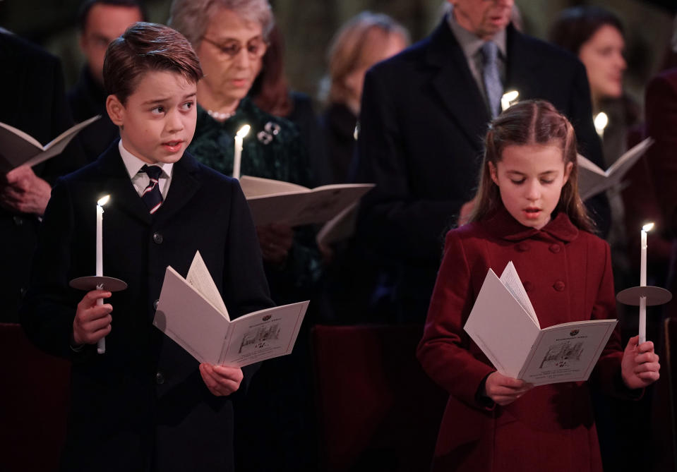 LONDON, ENGLAND - DECEMBER 15: In this photo released on December 24, Prince George and Princess Charlotte are seen during the 'Together at Christmas' Carol Service at Westminster Abbey on December 15, 2022 in London, England.  The service will be broadcast on ITV1 on Christmas Eve as part of a Royal Carols: Together At Christmas programme, narrated by Catherine Zeta Jones and featuring an introduction by Catherine, Princess of Wales and tributes to Queen Elizabeth II. (Photo Yui Mok - Pool/Getty Images)