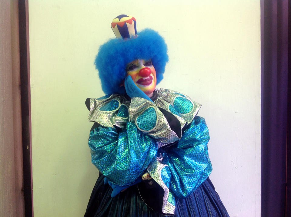 In this Tuesday, Oct. 23, 2012 photo, grostesque whiteface clown, Llantom, 60, poses for a photo during Mexico's 17th annual clown convention, La Feria de la Risa, in Mexico City. Approximately 500 clowns gathered at two local theaters in the capital city to exchange ideas, compete for laughs and show off their comedy performances. Llantom is the fair's principal event organizer and has been in the clown business for 19 years. (AP Photo/Anita Baca)