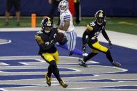 Pittsburgh Steelers safety Minkah Fitzpatrick (39) intercepts a Dallas Cowboys' Garrett Gilbert pass in the end zone as Cameron Sutton (20) and Cowboys wide receiver Cedrick Wilson (11) look on in the second half of an NFL football game in Arlington, Texas, Sunday, Nov. 8, 2020. (AP Photo/Ron Jenkins)