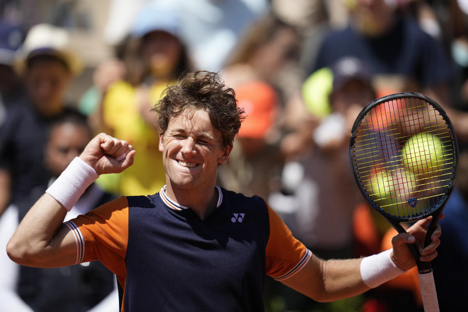 Norway's Casper Ruud celebrates winning his third round match of the French Open tennis tournament against China's Zhang Zhizhen, at the Roland Garros stadium in Paris, Saturday, June 3, 2023. (AP Photo/Christophe Ena)