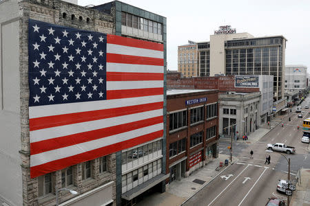 The U.S. flag decorates a building in downtown Memphis, Tennessee, U.S., March 27, 2018. REUTERS/Jonathan Ernst