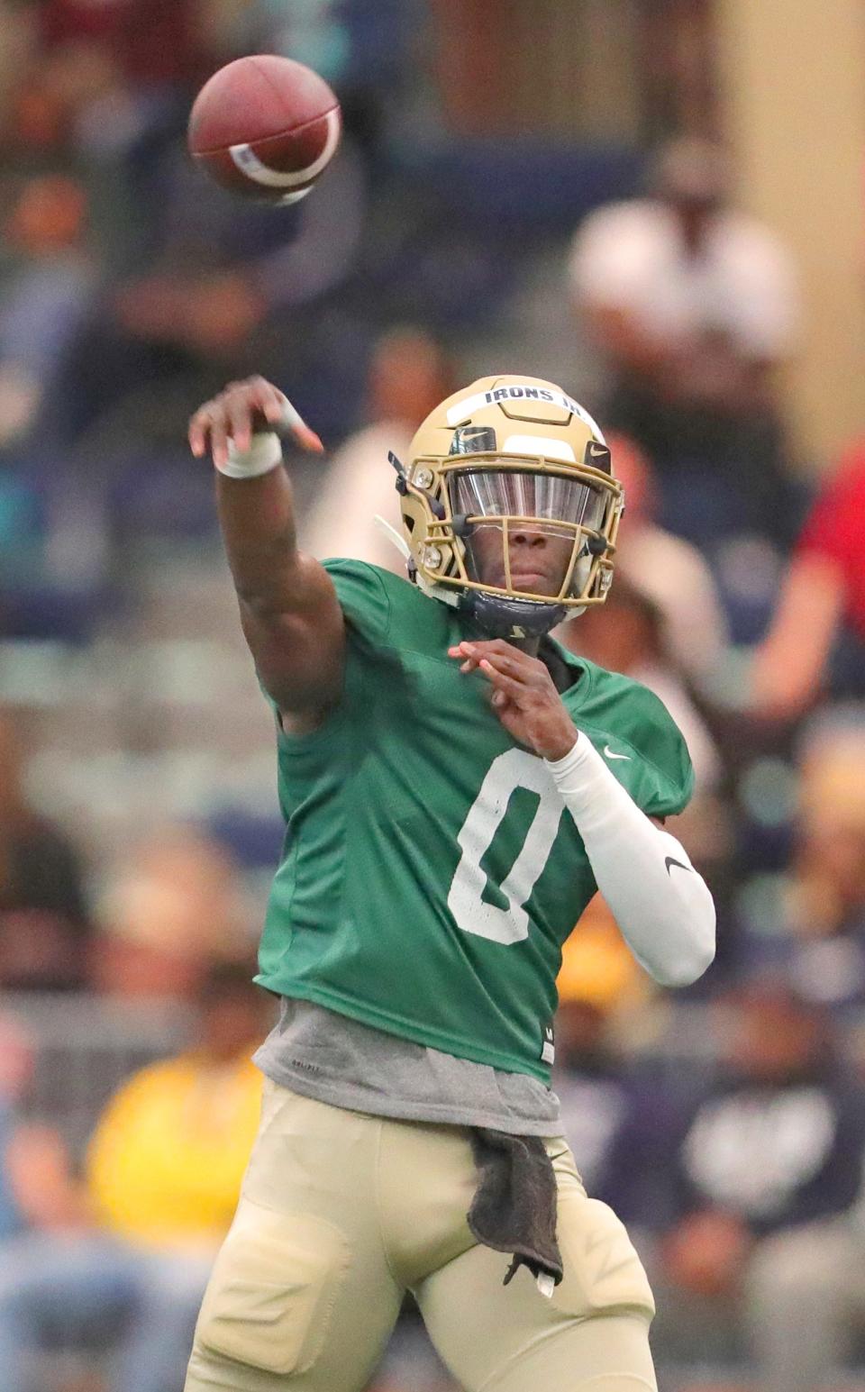 University of Akron quarterback DJ Irons throws a pass during the team's Blue & Gold Spring Game on Saturday at Stile Field House.