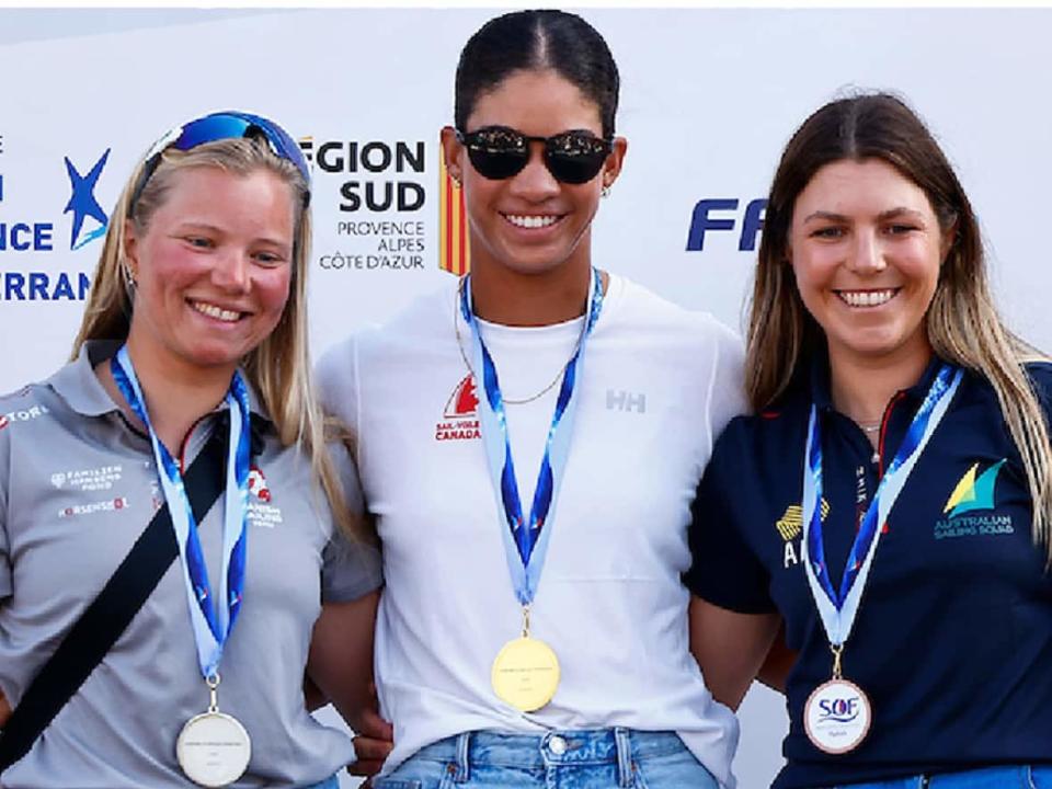 Toronto's Sarah Douglas, middle, beat 2020 Olympic champion Anne-Marie Rindom of Denmark to win a gold medal in ILCA 6 (small single-handed dinghy) at French Olympic Week in Hyeres, France.  (Submitted by Sail Canada - image credit)