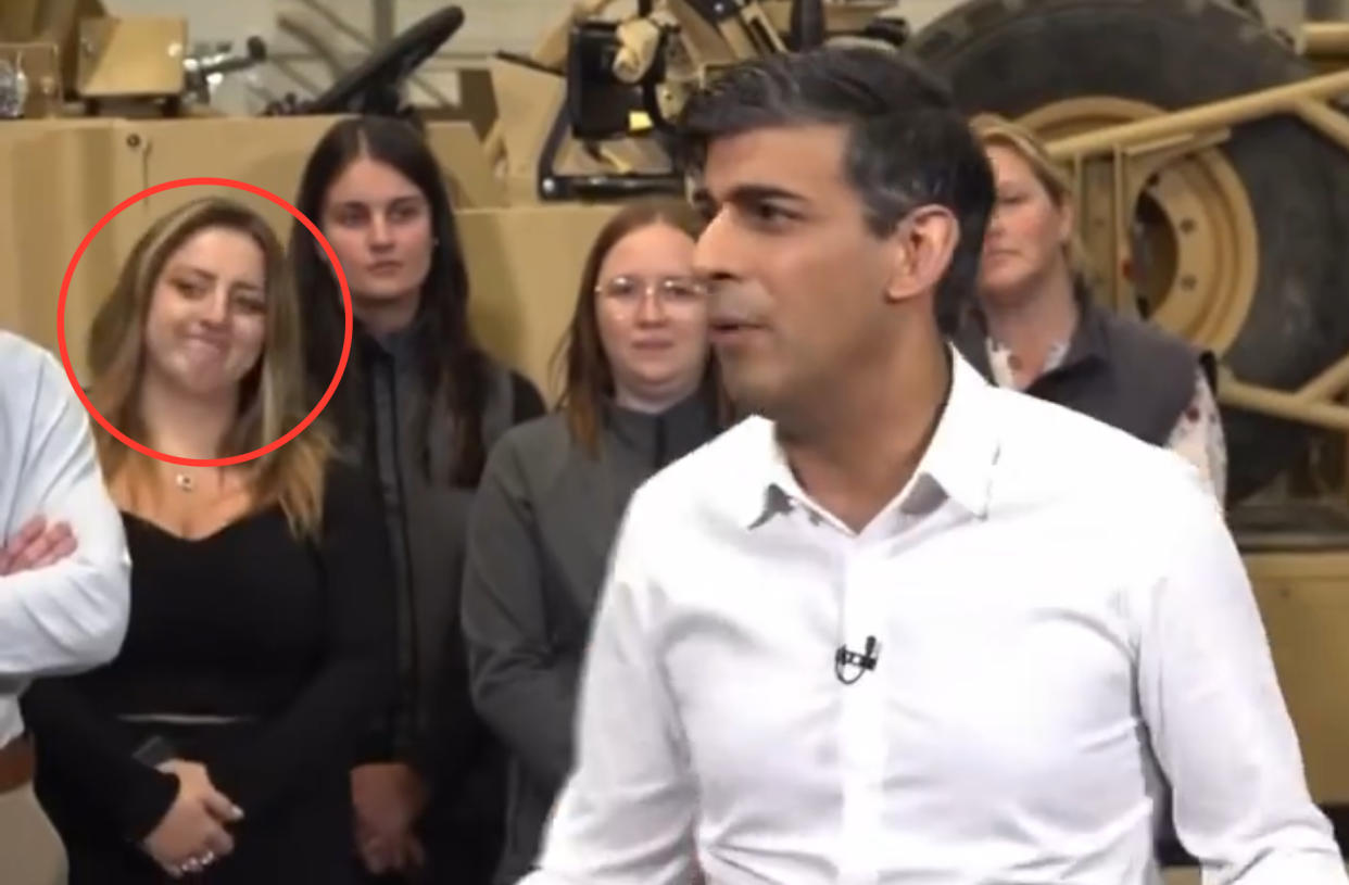 The woman behind Rishi Sunak appeared to laugh and grimace as the prime minister listed off what the Tories had achieved in government. (X)