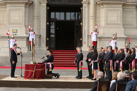 Peru's President Martin Vizcarra and new Defense Minister Jose Huerta attend a swearing-in ceremony at the government palace in Lima, Peru April 2, 2018. REUTERS/Guadalupe Pardo