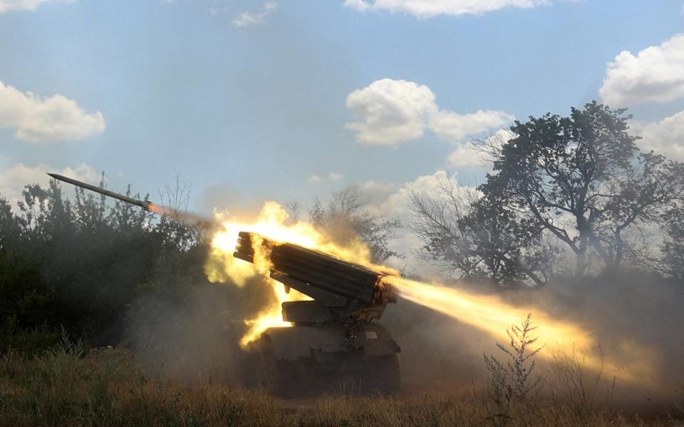 Ukrainian servicemen firing on Russian positions with a Grad BM-21 multiple rocket launcher. The more accurate Himars system can hit targets from further away, forcing Russian troops to push back - GETTY IMAGES