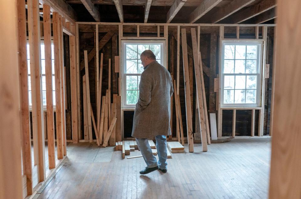 Bernard Mazzocchi walks through the former Fidelity Savings & Laon building he is renovating into a boutique hotel on Radcliffe St. in Bristol on Monday, Mar.4, 2024.