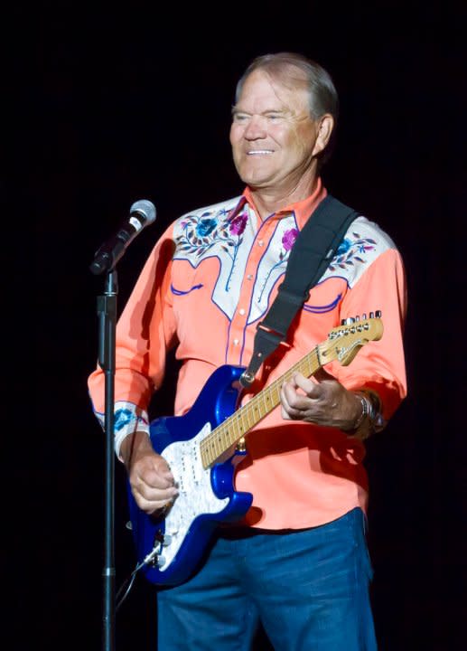 FILE – In this Sept. 6, 2012 file photo, singer Glen Campbell performs during his Goodbye Tour in Little Rock, Ark. Campbell finished off his Goodbye Tour on Friday night, Nov. 30, 2012, in Napa, Calif., but is considering scheduling more dates in 2013. The singer has Alzheimer’s disease. (AP Photo/Danny Johnston, File)