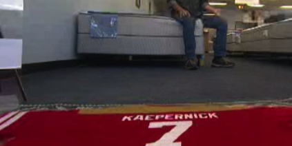 A suburban Chicago mattress salesman has a Colin Kaepernick jersey on his floor (chicago.cbslocal.com screen shot)