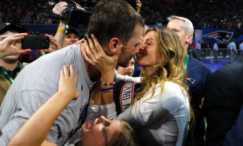 tom brady and his wife, gisele, celebrate after the super bowl