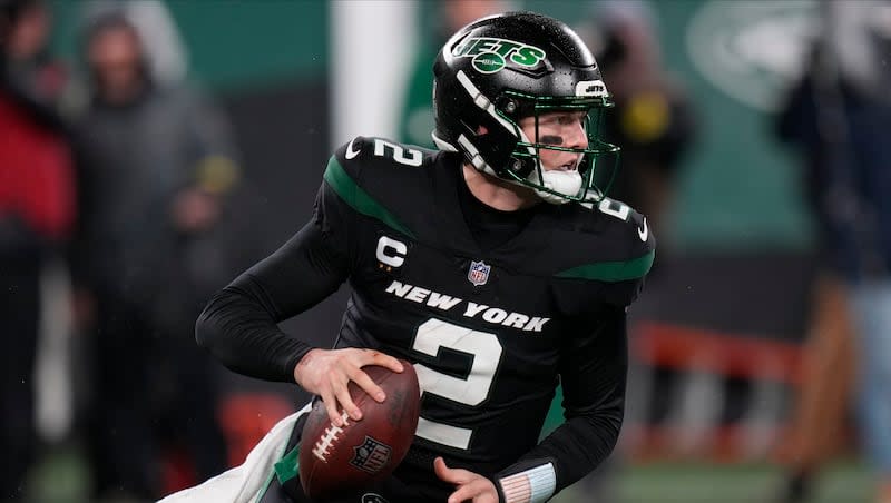 New York Jets quarterback Zach Wilson (2) looks to pass against the Jacksonville Jaguars during game Thursday, Dec. 22, 2022, in East Rutherford, N.J. The embattled former BYU QB has yet to land a deal with a new team.