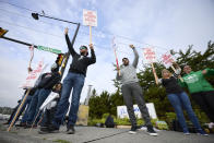 Boeing Machinists Union members and supporters wave to traffic on the picket line at the Renton assembly plant, Friday, Sept. 13, 2024, in Renton, Wash. (AP Photo/John Froschauer)