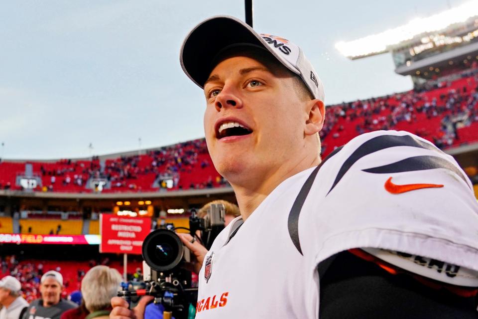 Cincinnati Bengals quarterback Joe Burrow (9) celebrates after winning the AFC Championship Game against the Kansas City Chiefs at GEHA Field at Arrowhead Stadium.