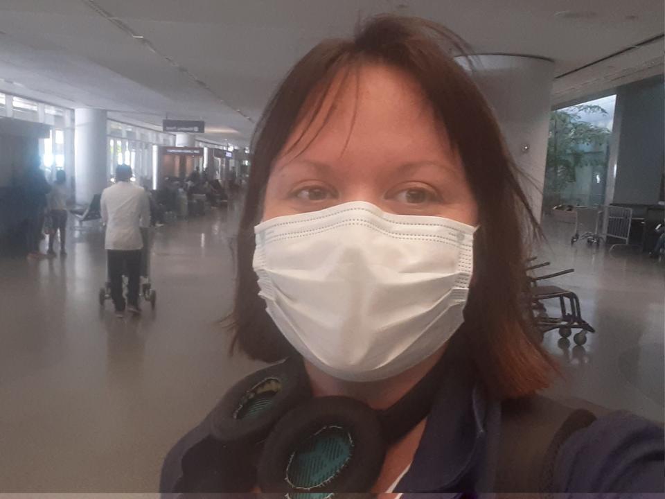 Marianne Guenot looking tired at a US airport where she just set off an airport radiation detector after a long haul flight.