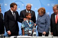 Twelve-year-old Timoci Naulusala from Fiji, a nation disappearing under rising seas, delivered a testimonial to ministers and heads of state