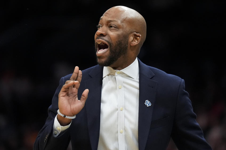 Saint Peter's head coach Bashir Mason yells during the first half of a first-round college basketball game against Tennessee in the NCAA Tournament, Thursday, March 21, 2024, in Charlotte, N.C. (AP Photo/Chris Carlson)