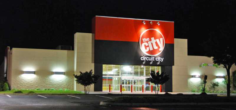 A Circuit City building at night.