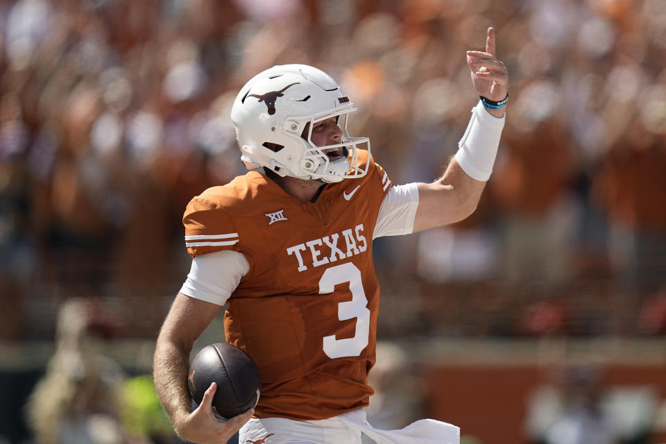 Texas quarterback Quinn Ewers (3) celebrates as he runs for a touchdown against Kansas during the first half of an NCAA college football game in Austin, Texas, Saturday, Sept. 30, 2023. (AP Photo/Eric Gay)