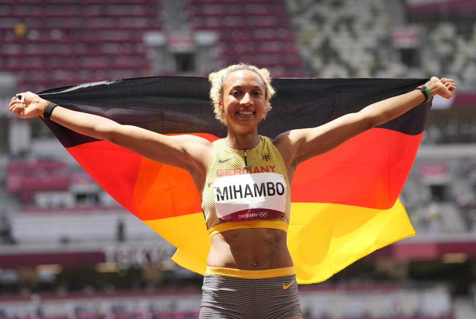 Malaika Mihambo, of Germany celebrates after winning the gold medal in the women's long jump final at the 2020 Summer Olympics, Tuesday, Aug. 3, 2021, in Tokyo, Japan. (AP Photo/Martin Meissner)