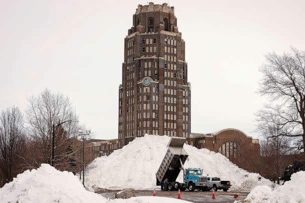 PHOTO: A dump truck drops off snow in front of Central Terminal following a winter storm in Buffalo, New York, Dec. 28, 2022. (Lindsay Dedario/Reuters)
