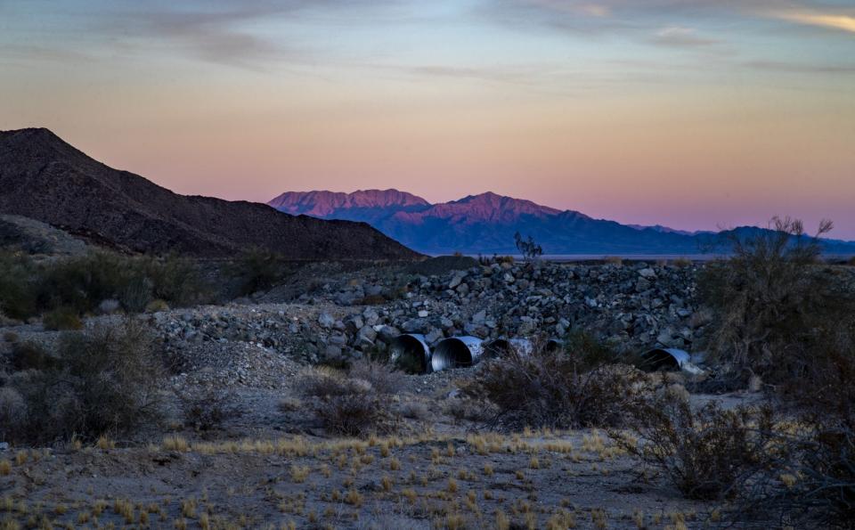 Dusk settles in over water culverts across from the Eagle Mountain Pumping Plant