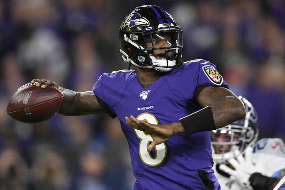 Baltimore Ravens quarterback Lamar Jackson (8) works in the pocket against the Tennessee Titans during the first half an NFL divisional playoff football game, Saturday, Jan. 11, 2020, in Baltimore. (AP Photo/Nick Wass)