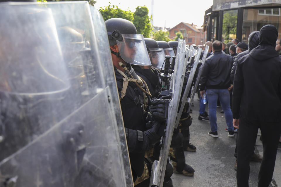 Hungarian soldiers serving in the NATO-led peacekeeping force KFOR guard a municipal building in the town of Zvecan, northern Kosovo, Monday, May 29, 2023. Serbia condemned NATO-led peacekeepers stationed in neighboring Kosovo for their alleged failure to stop "brutal actions" by Kosovo police against ethnic Serbs, and said that its armed forces stationed near the border will remain on the highest state of alert until further notice. (AP Photo/Bojan Slavkovic)