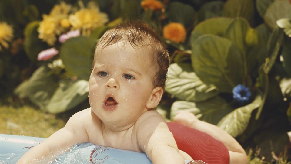 baby boy playing at wading pool