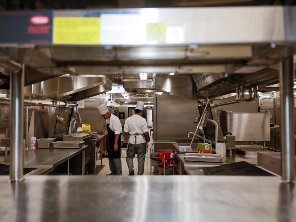 cooks  in a kitchen on Royal Caribbean's Icon of the Seas