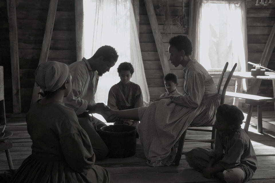 This image released by Apple TV+ shows, from left, Imani Pullum, Will Smith, Jeremiah Friedlander, Landon Chase Dubois, Charmaine Bingwa and Jordyn McIntosh in a scene from "Emancipation." (Quantrell Colbert/Apple TV+ via AP)