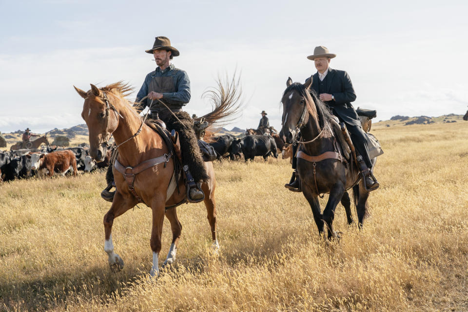 This image released by Netflix shows Benedict Cumberbatch, left, and Jesse Plemons in a scene from "The Power of the Dog." (Kirsty Griffin/Netflix via AP)