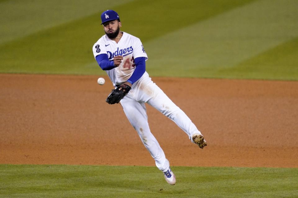 Edwin Rios tosses the ball