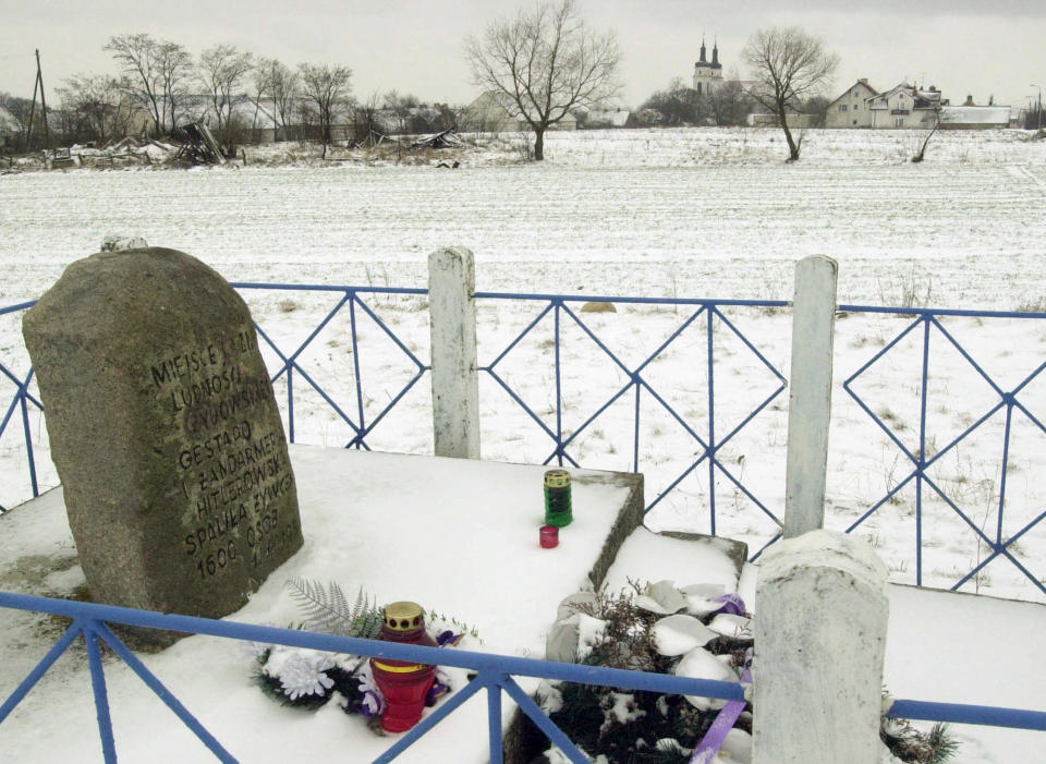 File - This Friday, 23 February, 2001 file photo shows a monument in Poland's eastern village of Jedwabne which commemorates the massacre of 1,600 local Jews burned alive by their neighbors - fellow Poles on July 10, 1941. A prominent Polish historian unearthed new evidence Wednesday, March 14, 2017 about Polish villagers' widespread killing of Jews fleeing Nazis during World War II, touching a raw nerve in a country still grappling with its role during the Holocaust. (AP Photo/Czarek Sokolowski, File)