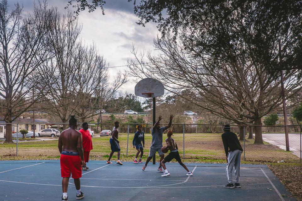 An afternoon pickup game in Carver Village, just steps away from where I-16 passes the neighborhood.