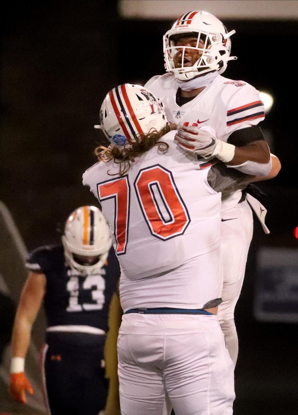 Oakland's Eric Taylor (5) celebrates his touchdown against Beech as Oakland's Kaden Mowl (70) lifts his up during the BlueCross Bowl Class 6A Championship game at Finley Stadium, in Chattanooga, Tenn., on Saturday, Dec. 3, 2022.  