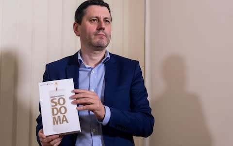 Frederic Martel with his new book, titled Sodoma in the Italian version - Credit: Tiziana Fabi/AFP