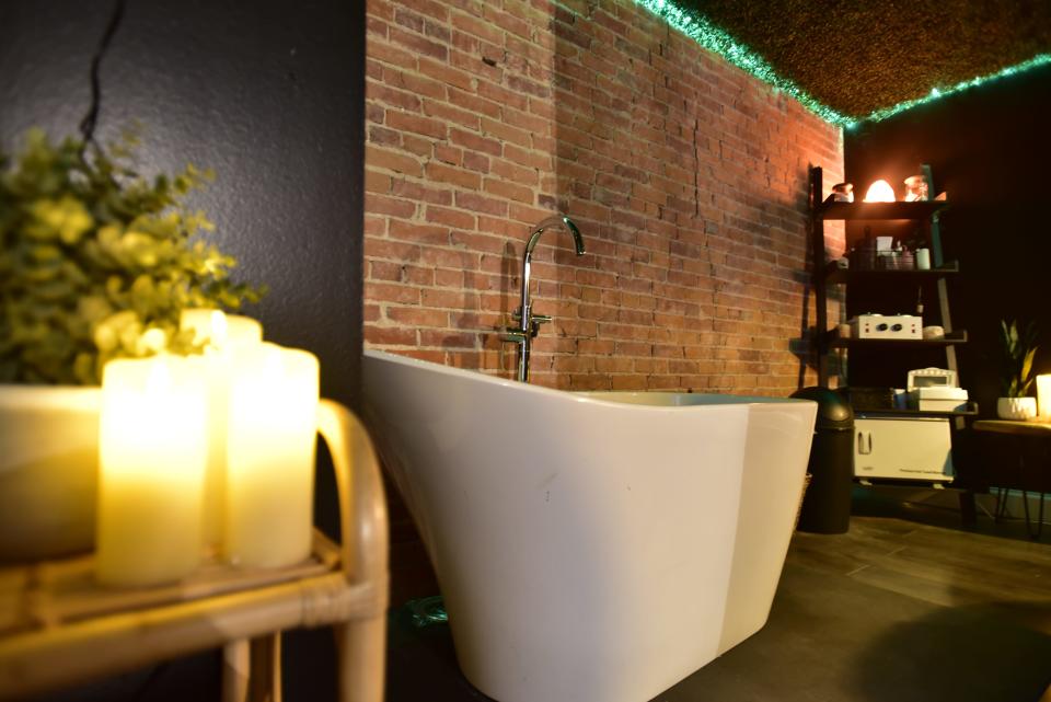 A bathtub for patrons to relax in as part of the spa room inside the Infinite Beauty & Wellness located on 914 Military Street adjacent to Magic Hat Tattoo and the Raven Cafe in downtown Port Huron on Friday, Nov. 11, 2022.