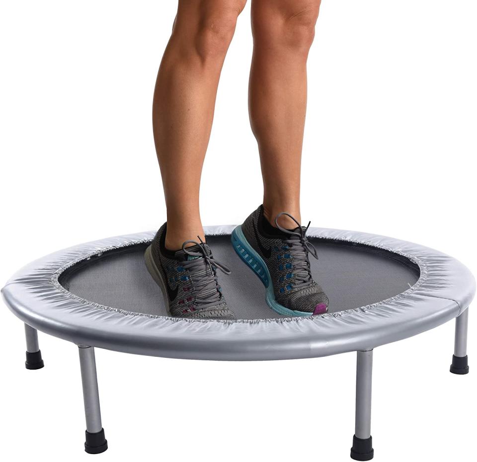 Person with feet on trampoline.