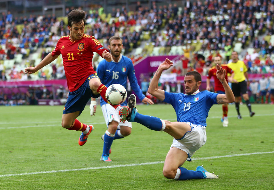 GDANSK, POLAND - JUNE 10: David Silva of Spain and Leonardo Bonucci of Italy compete for the ball during the UEFA EURO 2012 group C match between Spain and Italy at The Municipal Stadium on June 10, 2012 in Gdansk, Poland. (Photo by Michael Steele/Getty Images)