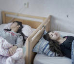 <p>Resignation syndrome: Djeneta (right) has been bedridden and unresponsive for two-and-a-half years, and her sister Ibadeta for more than six months, with uppgivenhetssyndrom (resignation syndrome), in Horndal, Sweden, March 2, 2017.<br>Djeneta and Ibadeta are Roma refugees, from Kosovo. Resignation syndrome (RS) renders patients passive, immobile, mute, unable to eat and drink, incontinent and unresponsive to physical stimulus. It is a condition believed to exist only amongst refugees in Sweden. The causes are unclear, but most professionals agree that trauma is a primary contributor, alongside a reaction to stress and depression. It is also not clear why cases are found exclusively in Sweden. RS has so far affected only refugees aged seven to 19, and mainly those from ex-Soviet countries or the former Yugoslavia. For many, the syndrome is triggered by having a residence application rejected. Granting residence to families of sufferers is often cited as a cure. (Photo: Magnus Wennman/Aftonbladet) </p>