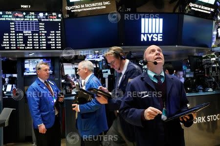 Traders work on the floor of the New York Stock Exchange (NYSE) in New York, U.S., April 19, 2017. REUTERS/Brendan McDermid