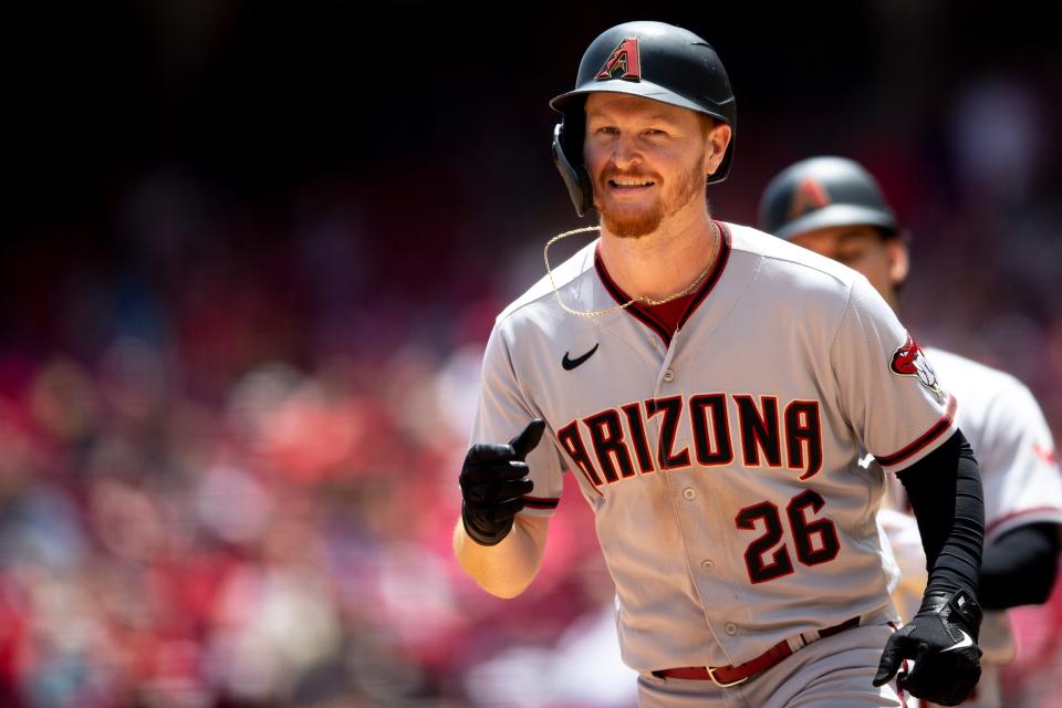 Arizona Diamondbacks right fielder Pavin Smith (26) smiles after hitting a solo home run in the fifth inning of the MLB game between the Cincinnati Reds and the Arizona Diamondbacks at Great American Ball Park in Cincinnati on Thursday, June 9, 2022.

Arizona Diamondbacks At Cincinnati Reds
