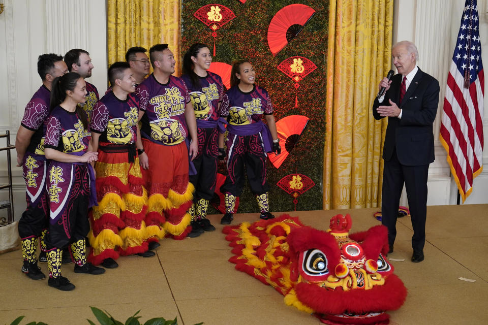 President Joe Biden speaks to performers during a reception to celebrate the Lunar New Year in the East Room of the White House in Washington, Thursday, Jan. 26, 2023. (AP Photo/Susan Walsh)