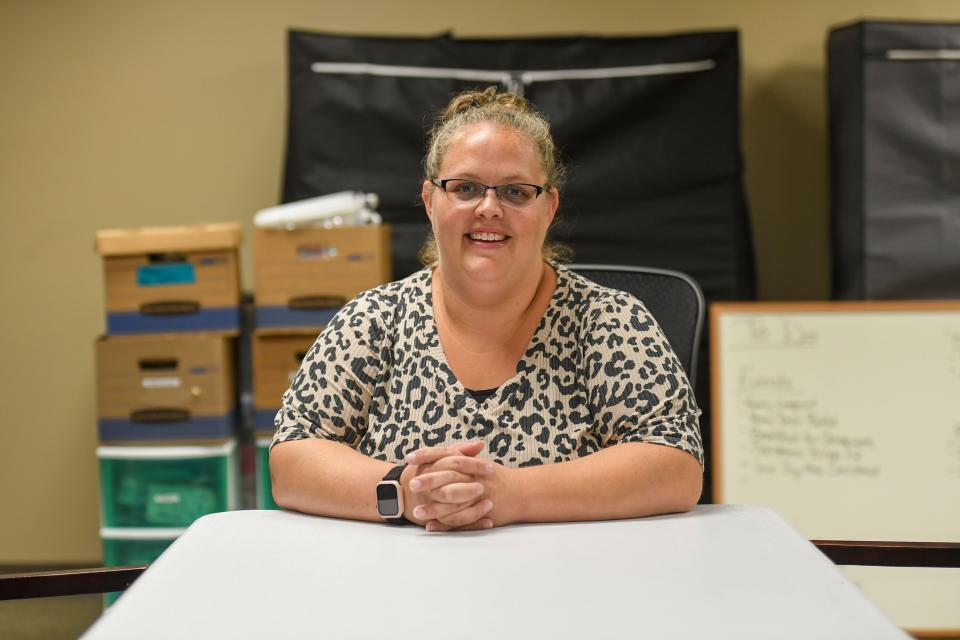 Holly Christensen poses in one of the organizing rooms at the Foster Network office in Sioux Falls on Tuesday, Sept. 12, 2023.