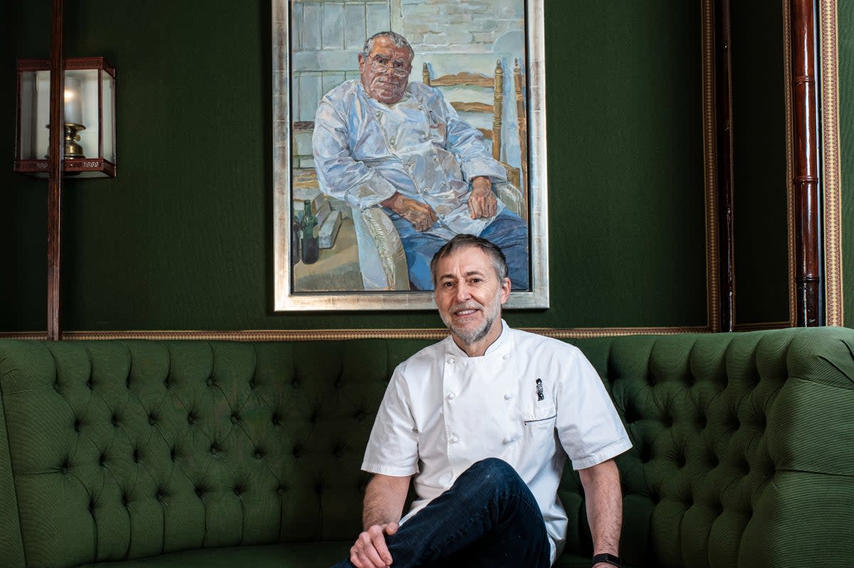 Family legacy: Michel Roux Jr with a portrait of his father Albert, who opened the restaurant in 1967  (Daniel Hambury/Stella Pictures Ltd)